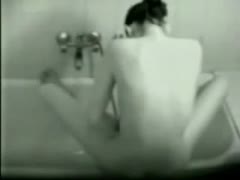 Wet wife gets caught on a hidden cam while she is masturbating in the bathroom